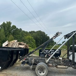 Roll off truck hauling construction debris